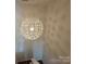 Hallway with a unique decorative light fixture and carpeted stairs at 509 Settlers Grove Ln, Salisbury, NC 28146