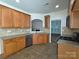 Well-maintained kitchen with oak cabinets, tile backsplash, and modern stainless steel appliances at 509 Settlers Grove Ln, Salisbury, NC 28146