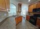 Kitchen featuring ample cabinet space, tiled floors, and a black gas range at 509 Settlers Grove Ln, Salisbury, NC 28146