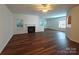 Spacious living area with hardwood floors, fireplace, and open layout to the dining area at 509 Settlers Grove Ln, Salisbury, NC 28146