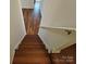Hardwood stairs lead to an upper level, complete with a handrail for added safety and support at 509 Settlers Grove Ln, Salisbury, NC 28146