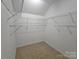 Spacious walk-in closet featuring shelving and ample storage space for a well-organized wardrobe at 509 Settlers Grove Ln, Salisbury, NC 28146