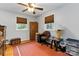 Bright bedroom with wood floors, two windows and overhead fan at 5111 Tewkesbury Rd, Charlotte, NC 28269