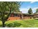 Charming brick home featuring a well-manicured lawn and classic architectural details at 5111 Tewkesbury Rd, Charlotte, NC 28269