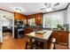 Bright kitchen showcasing wood cabinets, stainless appliances, and a charming breakfast bar at 5111 Tewkesbury Rd, Charlotte, NC 28269