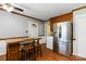 The Kitchen has a breakfast bar, stainless steel refrigerator, and an exterior door to the backyard at 5111 Tewkesbury Rd, Charlotte, NC 28269