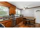 Charming kitchen features wood cabinetry, stainless steel appliances, and a breakfast bar at 5111 Tewkesbury Rd, Charlotte, NC 28269
