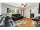 Spacious living room with hardwood floors and comfortable leather seating at 5111 Tewkesbury Rd, Charlotte, NC 28269