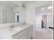 Well-lit bathroom with double vanity, quartz countertops, and a view to the hallway at 512 Beverly Cir, Charlotte, NC 28270