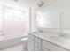 Bright bathroom featuring double vanity, quartz countertops, and a bathtub at 512 Beverly Cir, Charlotte, NC 28270