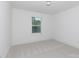 Bright bedroom featuring a window and neutral carpet at 512 Beverly Cir, Charlotte, NC 28270