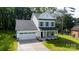 Charming two-story home with a two car garage, stone accents, and a well manicured front lawn at 512 Beverly Cir, Charlotte, NC 28270
