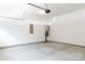 Spacious garage with concrete floors, water heater, electrical panel and ample room for parking at 512 Beverly Cir, Charlotte, NC 28270