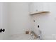 Laundry room with white cabinets and tiled floors, awaiting appliances at 512 Beverly Cir, Charlotte, NC 28270