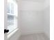 This walk-in closet provides ample storage, a window and natural light at 512 Beverly Cir, Charlotte, NC 28270