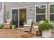 A view of the back deck featuring outdoor seating with wood floors at 524 Tayberry Ln, Fort Mill, SC 29715