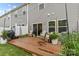 A cozy backyard deck with outdoor seating is set against the home's exterior at 524 Tayberry Ln, Fort Mill, SC 29715