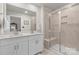 Modern bathroom with double vanity sinks, glass shower, and neutral color palette at 524 Tayberry Ln, Fort Mill, SC 29715