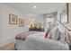 Comfortable bedroom with dresser, mirror and a bright window at 524 Tayberry Ln, Fort Mill, SC 29715