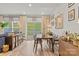 Open-concept dining area with sliding glass doors and views of the outdoor green space at 524 Tayberry Ln, Fort Mill, SC 29715