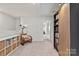 Charming upstairs hallway area with a rocking chair and built in bookcase at 524 Tayberry Ln, Fort Mill, SC 29715