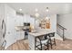 Bright kitchen with white cabinetry, granite countertops, and a breakfast bar at 524 Tayberry Ln, Fort Mill, SC 29715