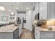 Bright kitchen with white cabinets, stainless steel appliances, and a granite island at 524 Tayberry Ln, Fort Mill, SC 29715