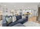 Open-concept living room seamlessly connects the seating area to the modern kitchen and dining space at 524 Tayberry Ln, Fort Mill, SC 29715