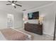 Bright and airy main bedroom featuring a sleek dresser and television at 524 Tayberry Ln, Fort Mill, SC 29715