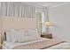 Bright and airy main bedroom featuring a large headboard and neutral tones at 524 Tayberry Ln, Fort Mill, SC 29715