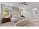 Bright and airy main bedroom featuring a ceiling fan and an en suite bathroom at 524 Tayberry Ln, Fort Mill, SC 29715