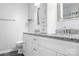 Elegant bathroom featuring dual granite sinks, white cabinetry, and modern fixtures at 5400 Groveton Ct, Charlotte, NC 28269