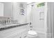 Modern bathroom featuring subway tile, updated vanity, and shower/tub combo with stylish fixtures at 5400 Groveton Ct, Charlotte, NC 28269