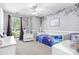 Charming bedroom with purple accent wall, playful decor, and plenty of natural light at 5400 Groveton Ct, Charlotte, NC 28269