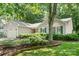 Beautiful single-story home with well-maintained landscaping, healthy bushes, and a lush green lawn at 5400 Groveton Ct, Charlotte, NC 28269