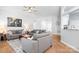 Spacious living room with wood flooring and neutral paint, offering ample seating and a seamless open layout at 5400 Groveton Ct, Charlotte, NC 28269
