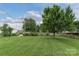 A roomy backyard is perfect for activities, with a luscious lawn and shade trees at 6206 Clearwater Dr, Indian Trail, NC 28079