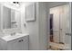 Bright bathroom with vanity, mirror, and clean finishes at 6206 Clearwater Dr, Indian Trail, NC 28079