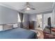 Bedroom with ceiling fan, wood floors, and an ensuite bathroom at 6206 Clearwater Dr, Indian Trail, NC 28079
