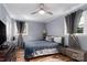 Bedroom with two windows, wood look floors, and modern decor at 6206 Clearwater Dr, Indian Trail, NC 28079