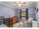 Charming Bedroom with crib, glider, and soft, neutral colors at 6206 Clearwater Dr, Indian Trail, NC 28079