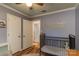 Another view of the Bedroom with crib, soft rug, and bright decor at 6206 Clearwater Dr, Indian Trail, NC 28079