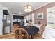 Cozy dining area with round table, wooden chairs, and adjacent kitchen at 6206 Clearwater Dr, Indian Trail, NC 28079
