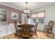 Cozy dining area featuring a round table, classic chairs, and natural light from the windows at 6206 Clearwater Dr, Indian Trail, NC 28079
