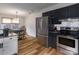 Functional kitchen with stainless steel appliances, ample storage, and adjacent dining area at 6206 Clearwater Dr, Indian Trail, NC 28079