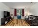 Open living space with new floors, large windows, and plenty of room for entertaining at 6206 Clearwater Dr, Indian Trail, NC 28079