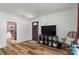 Spacious living room with wood-look floors, comfortable seating, and an open layout at 6206 Clearwater Dr, Indian Trail, NC 28079