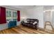 Bright living room showcasing new flooring, neutral decor, and a relaxing atmosphere at 6206 Clearwater Dr, Indian Trail, NC 28079