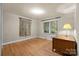 Bright bedroom with hardwood floors, neutral paint, and ample natural light at 6207 Robinson Church Rd, Charlotte, NC 28215