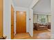The entryway features a wooden front door, hardwood floors, and a glimpse into the spacious living room at 6207 Robinson Church Rd, Charlotte, NC 28215